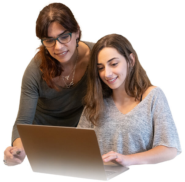 mother and daughter looking at a laptop together